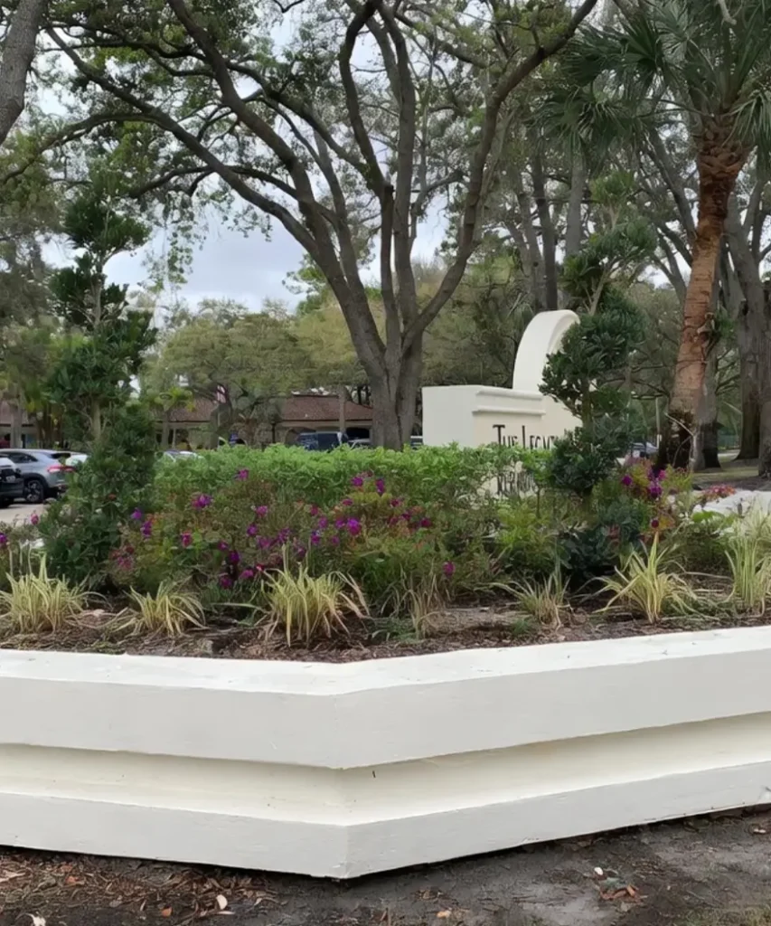 Tiered White Planter with Purple Blooms